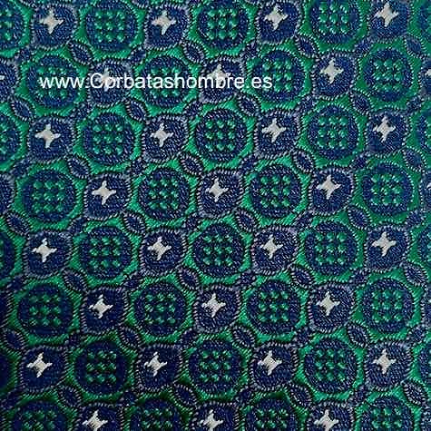 CORBATA ESTRECHA VERDE CON FONDO AZUL MARINO Y ESTRELLAS PEQUEÑAS BLANCAS DE TELA JACQUARD 