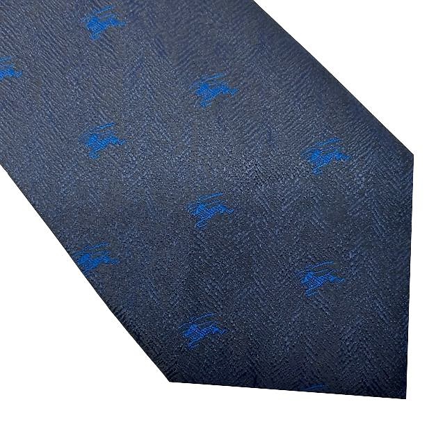 CORBATA DE TELA JASPEADA AZUL MARINO OSCURA CON CABALLEROS MEDIEVALES AZULES 